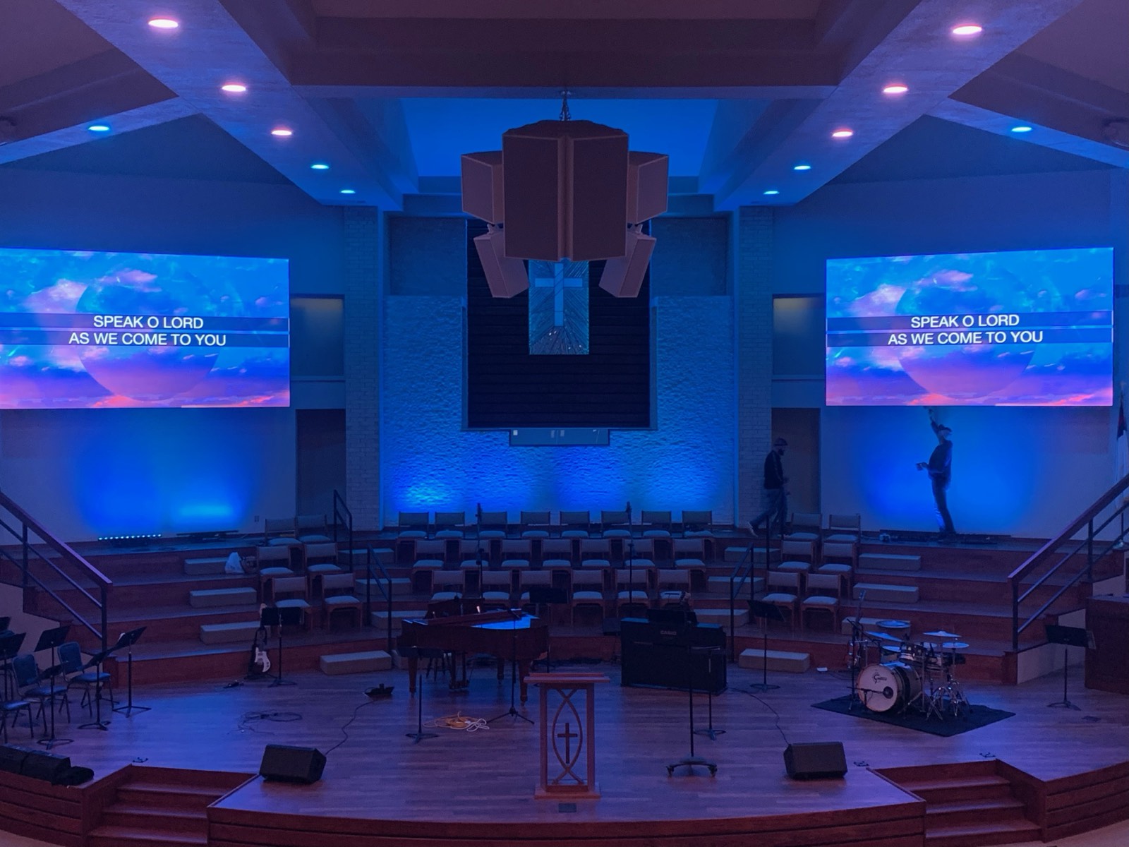 Church sanctuary with twin LED video walls flanking the stage at Chisholm Heights Baptist Church, Mustang, Oklahoma