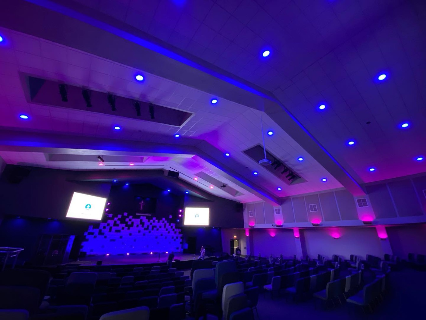 Sanctuary washed in color with an LED pixel wall behind the stage