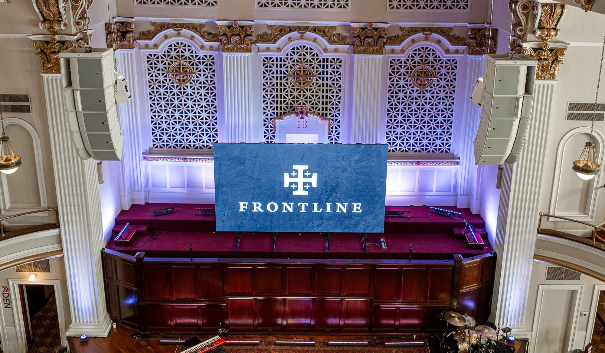 Line arrays and stage lighting installed by Emerald Wave in the historic Frontline Church sanctuary, Oklahoma City